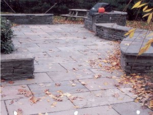 Flagstone patio with retaining wallstone